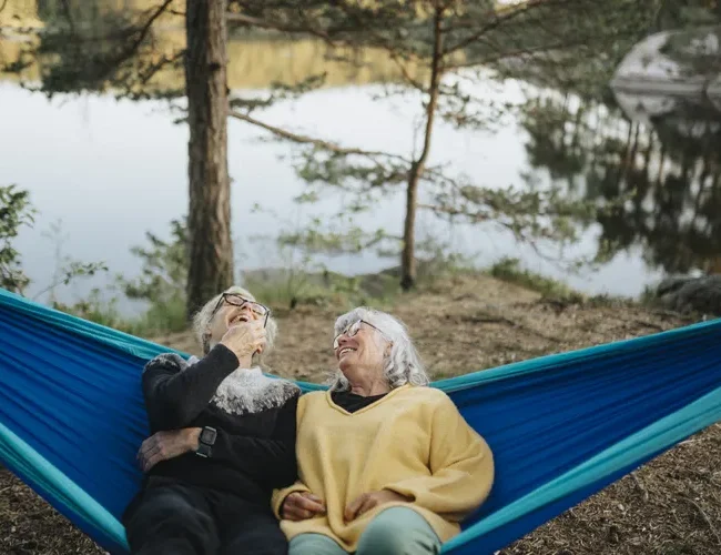 Couple meeting with a financial advisor to discuss retirement savings, retirement income, and long-term financial planning.