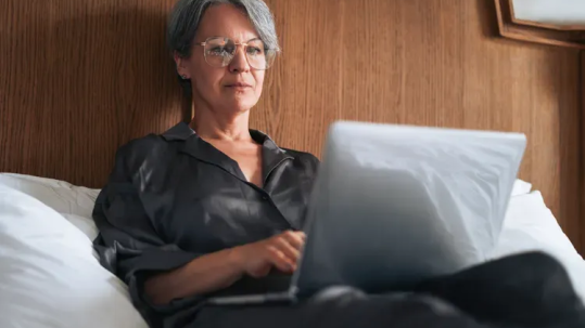 Financial advisor reviewing net worth, retirement savings, debt, and financial goals with clients.