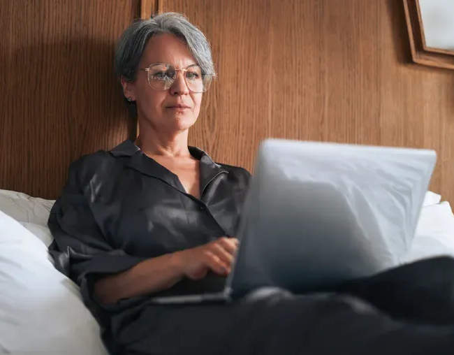 Financial advisor reviewing net worth, retirement savings, debt, and financial goals with clients.