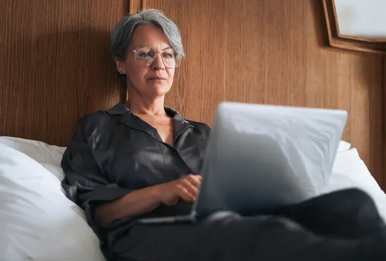 Financial advisor reviewing net worth, retirement savings, debt, and financial goals with clients.