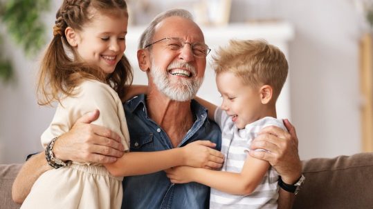 Grandparents comparing Trump Accounts and 529 College Savings Plans to help fund a grandchild's future education.