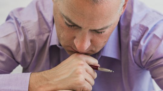 Financial advisor discussing Roth IRA conversion strategies, retirement tax planning, and investment accounts with a client.