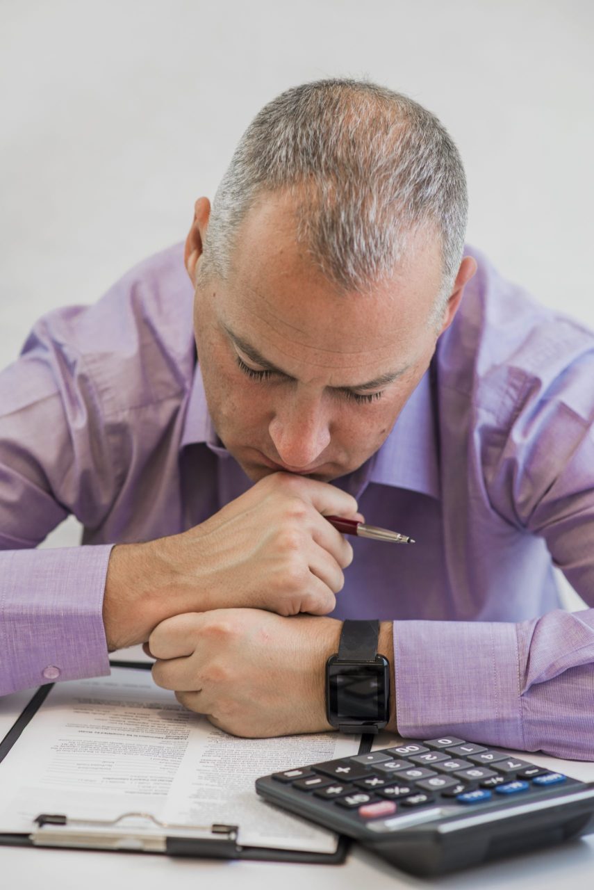Financial advisor discussing Roth IRA conversion strategies, retirement tax planning, and investment accounts with a client.