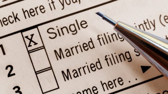 Single and married households reviewing finances and comparing net worth