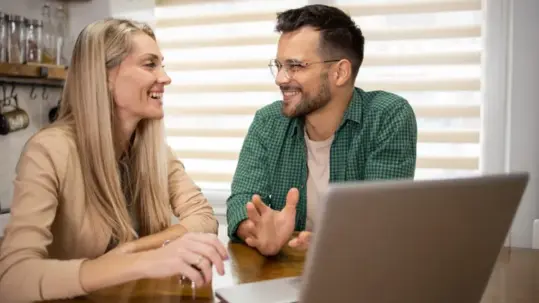 Millennial couple reviewing retirement savings and long-term financial planning