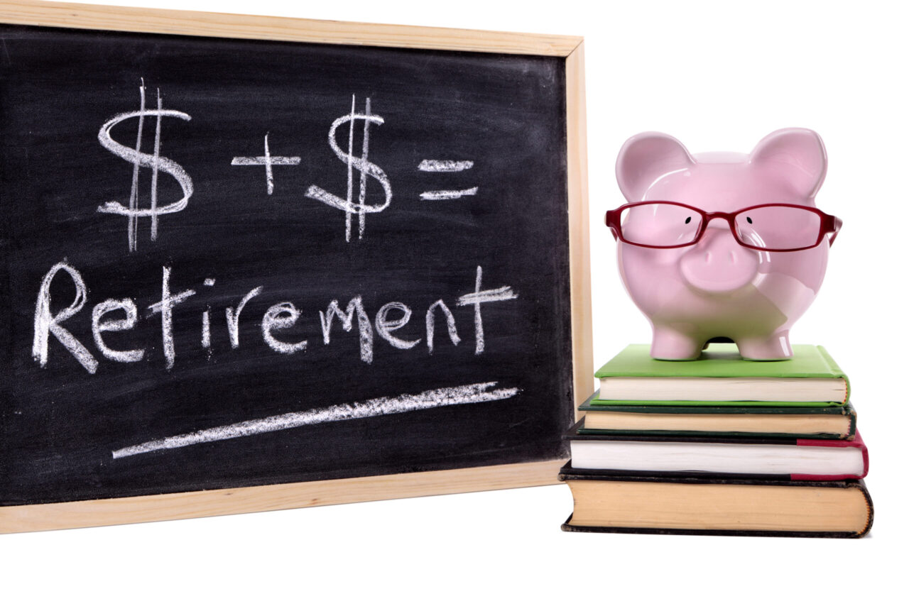 Piggy bank beside a retirement savings calculation representing retirement budgeting in Southwest Florida