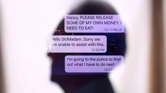 Person reviewing a suspicious financial scam message on a smartphone