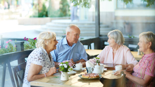 Older adults enjoying time together in a 55+ community while planning for retirement lifestyle changes