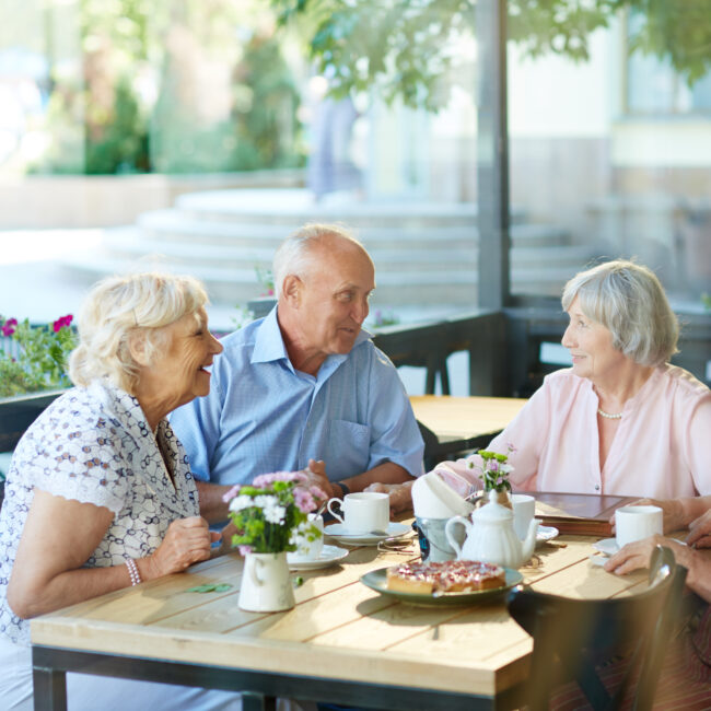 Older adults enjoying time together in a 55+ community while planning for retirement lifestyle changes