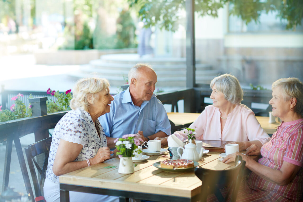 Older adults enjoying time together in a 55+ community while planning for retirement lifestyle changes