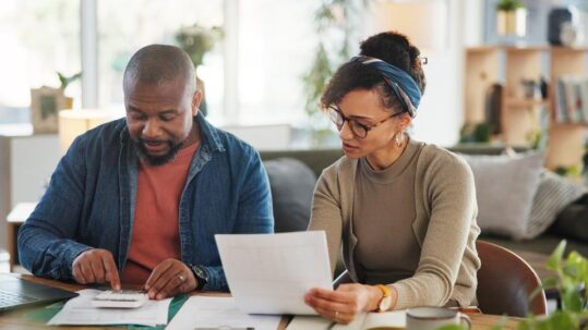 Investor reviewing portfolio gains and losses as part of a year-end tax-loss harvesting strategy