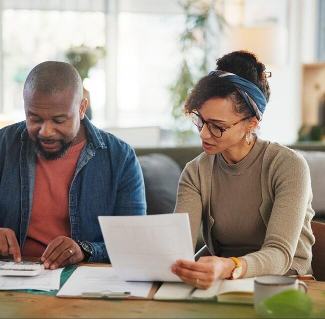 Investor reviewing portfolio gains and losses as part of a year-end tax-loss harvesting strategy