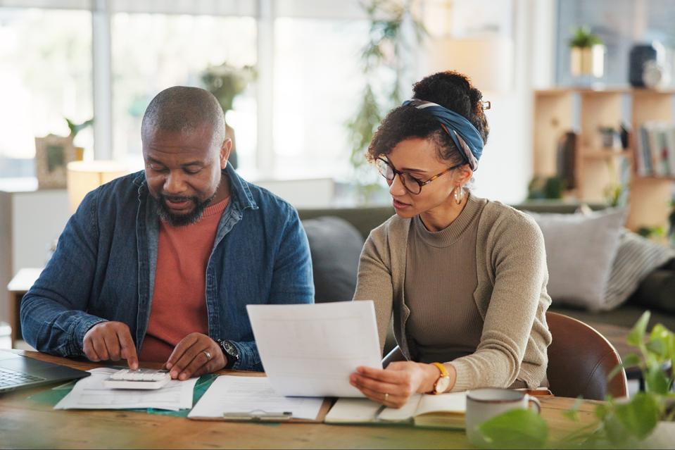 Investor reviewing portfolio gains and losses as part of a year-end tax-loss harvesting strategy