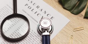 Doctor's stethoscope, medical record and health insurance document. Concept of healthcare