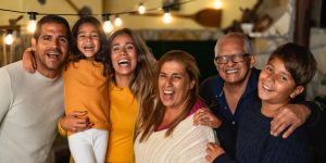 Happy Hispanic family enjoying holidays together at home